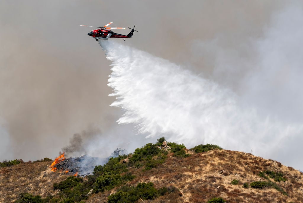 OCFA FireHawk doing a drop over fire