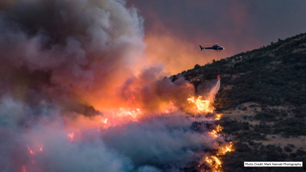 wildfire with airplane above