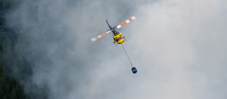 yellow helicopter bearing water