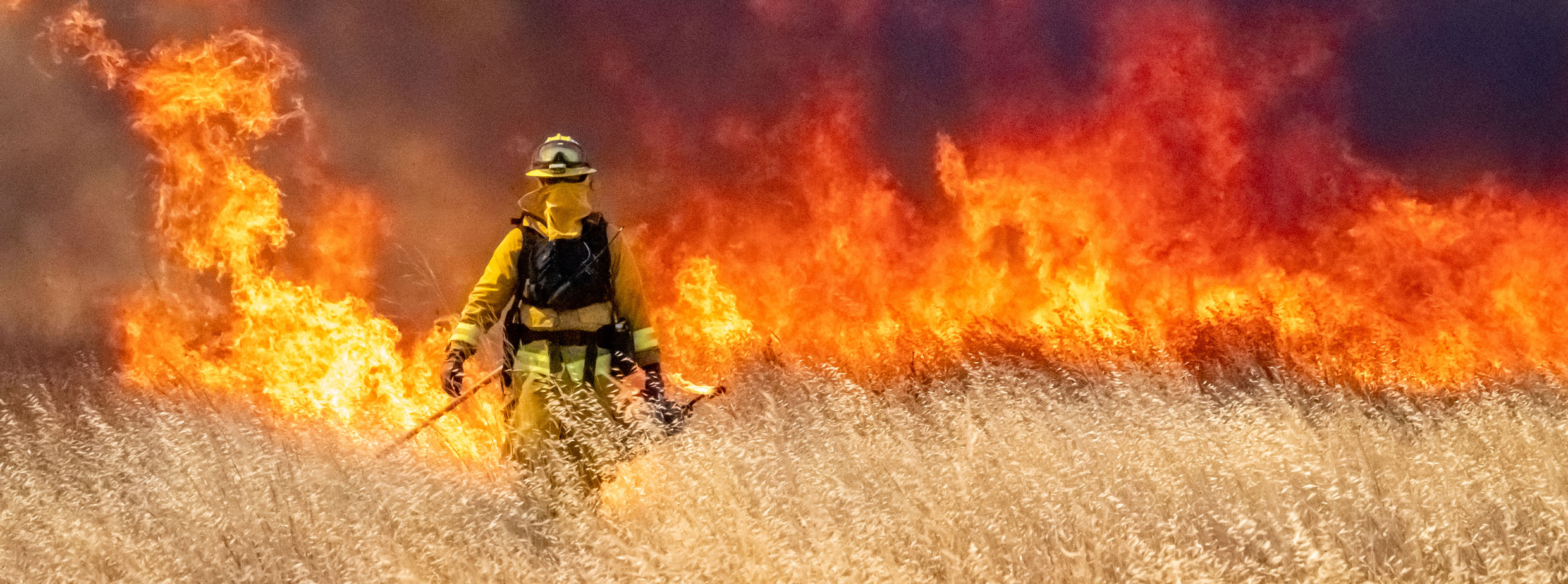 Firefighter stares down wildfire