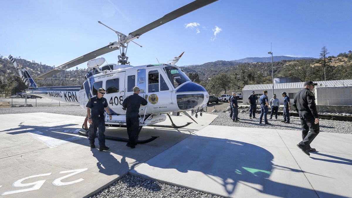 pilots by their helicopter