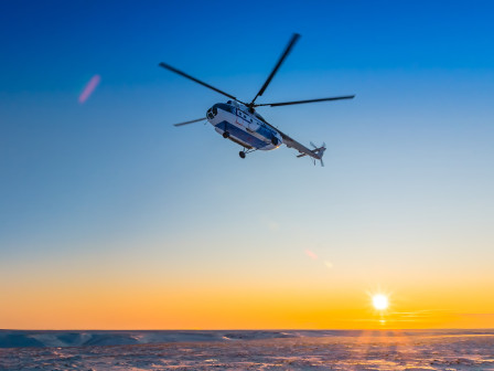 helicopter in horizon with sunset